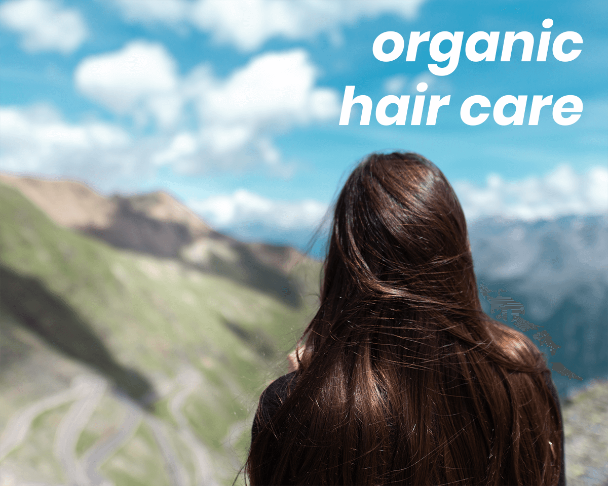 woman looking over mountains, with shiny hair